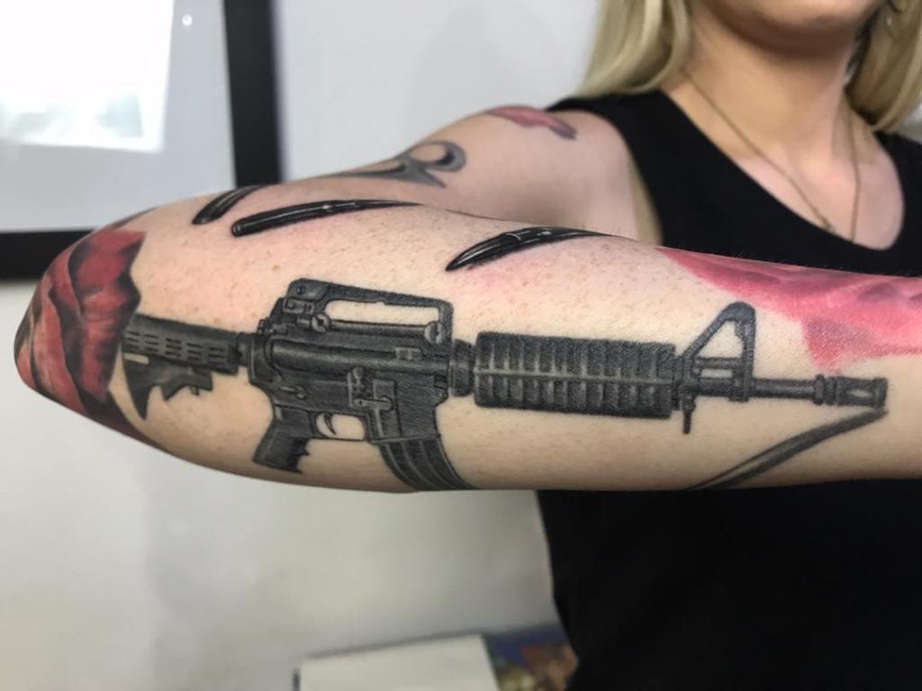 что означает тату пистолет